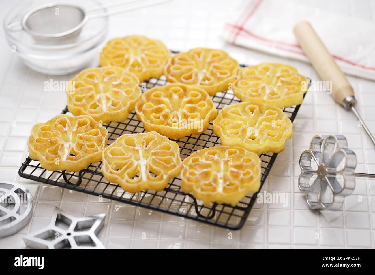 rosette cookies ( flower ) on a cake cooling rack Stock Photo