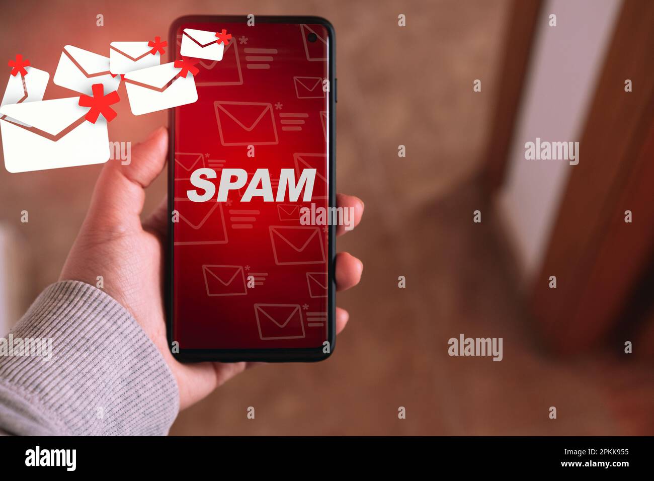 Woman showing mail spam on her smartphone. Communication business technology. Protect spam mail from internet cyber security. Stock Photo