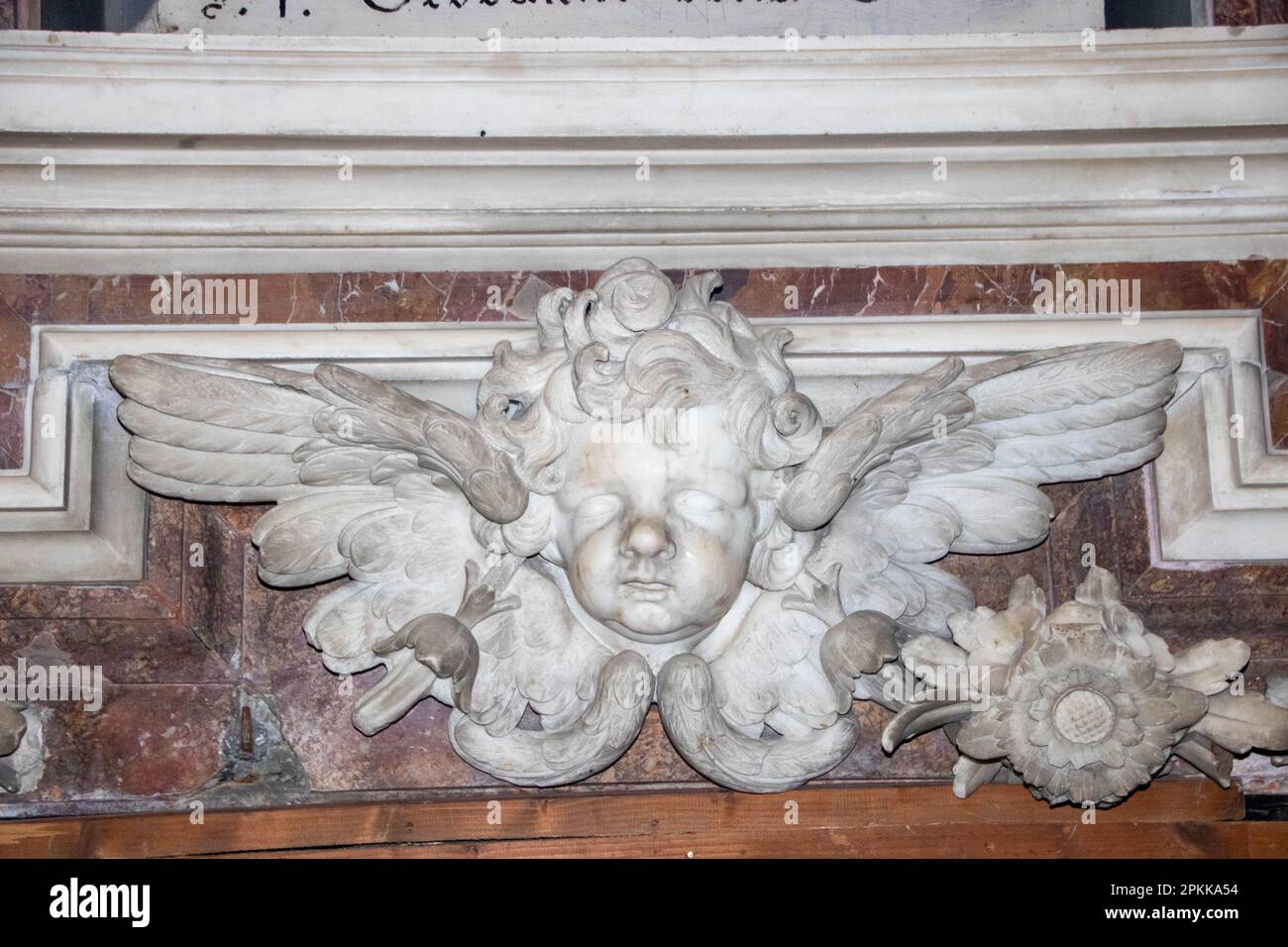 sculpture of an angel in baroque styke in Santa Teresa degli Scalzi, church in the historic center of Naples, Italy Stock Photo