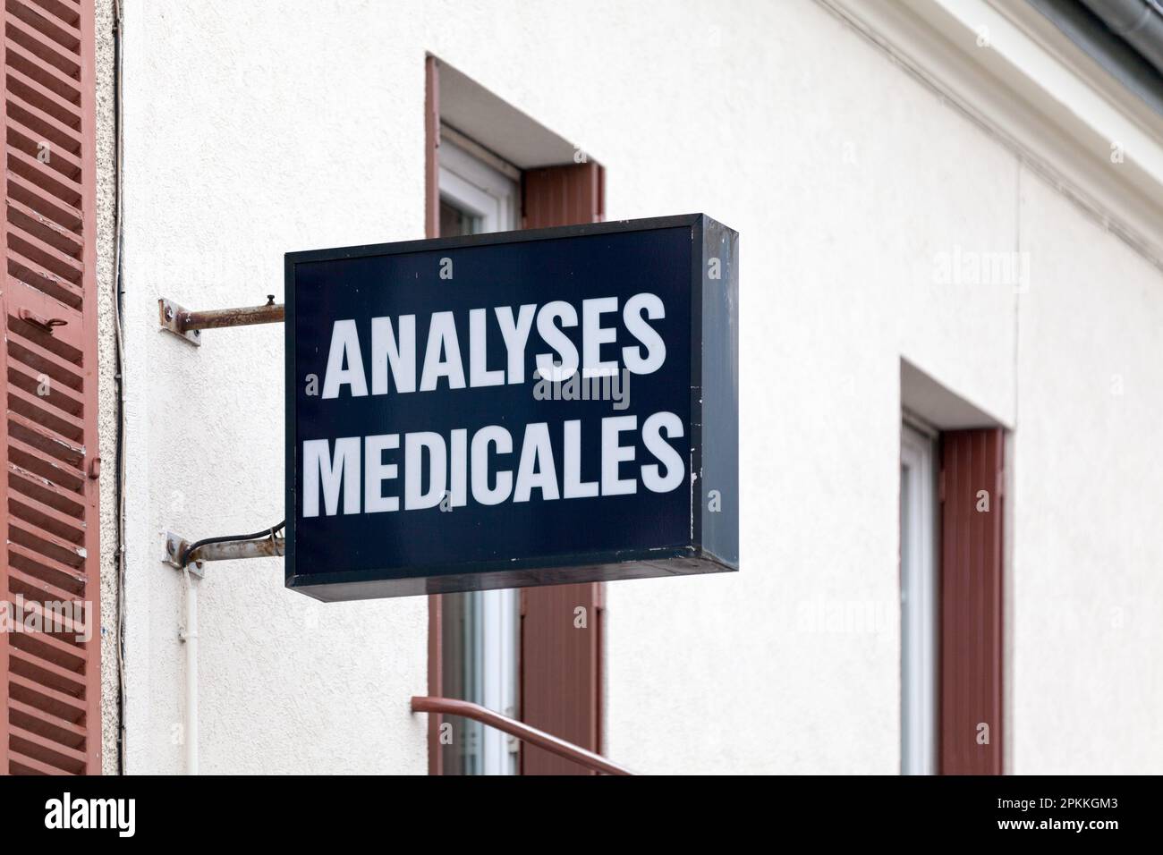 Sign attached to the facade of a laboratory indicating in French that