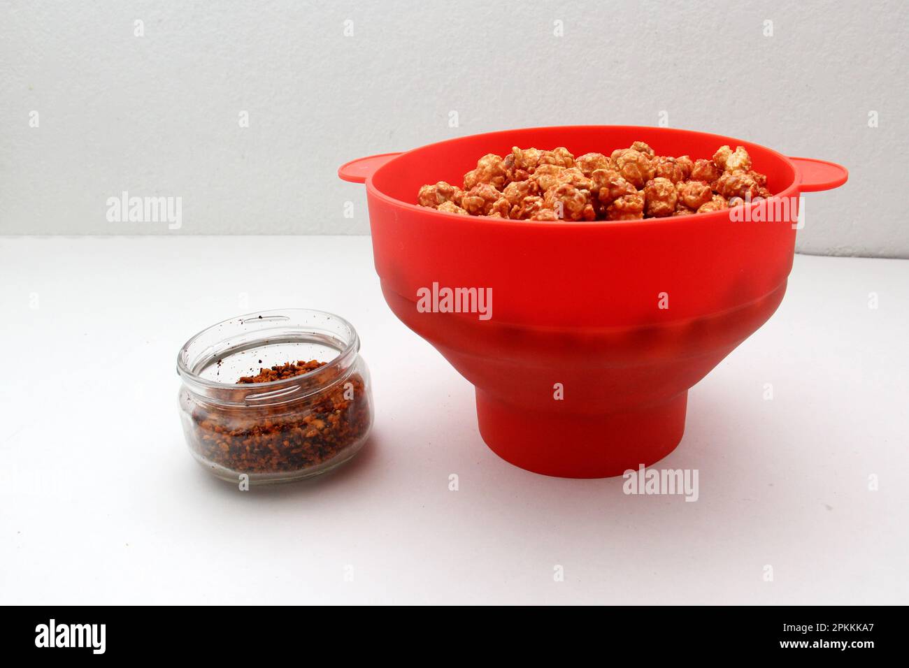 Chili Covered Popcorn Made in Red Microwave Container Stock Photo Alamy