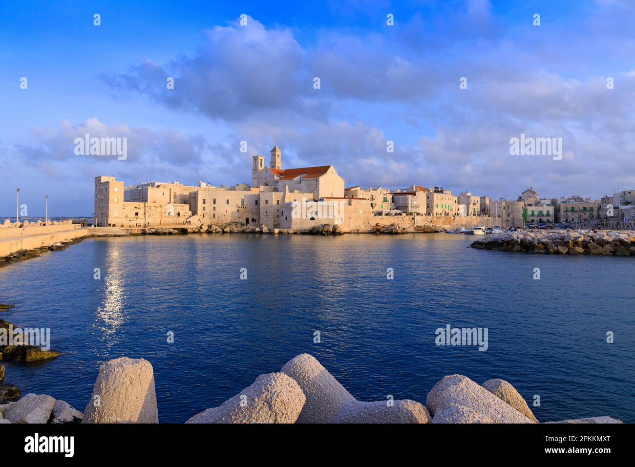 Giovinazzo old town in Apulia, Italy: view of the harbor with the Cathedral of Santa Maria Assunta in Apulian Romanesque style. Stock Photo
