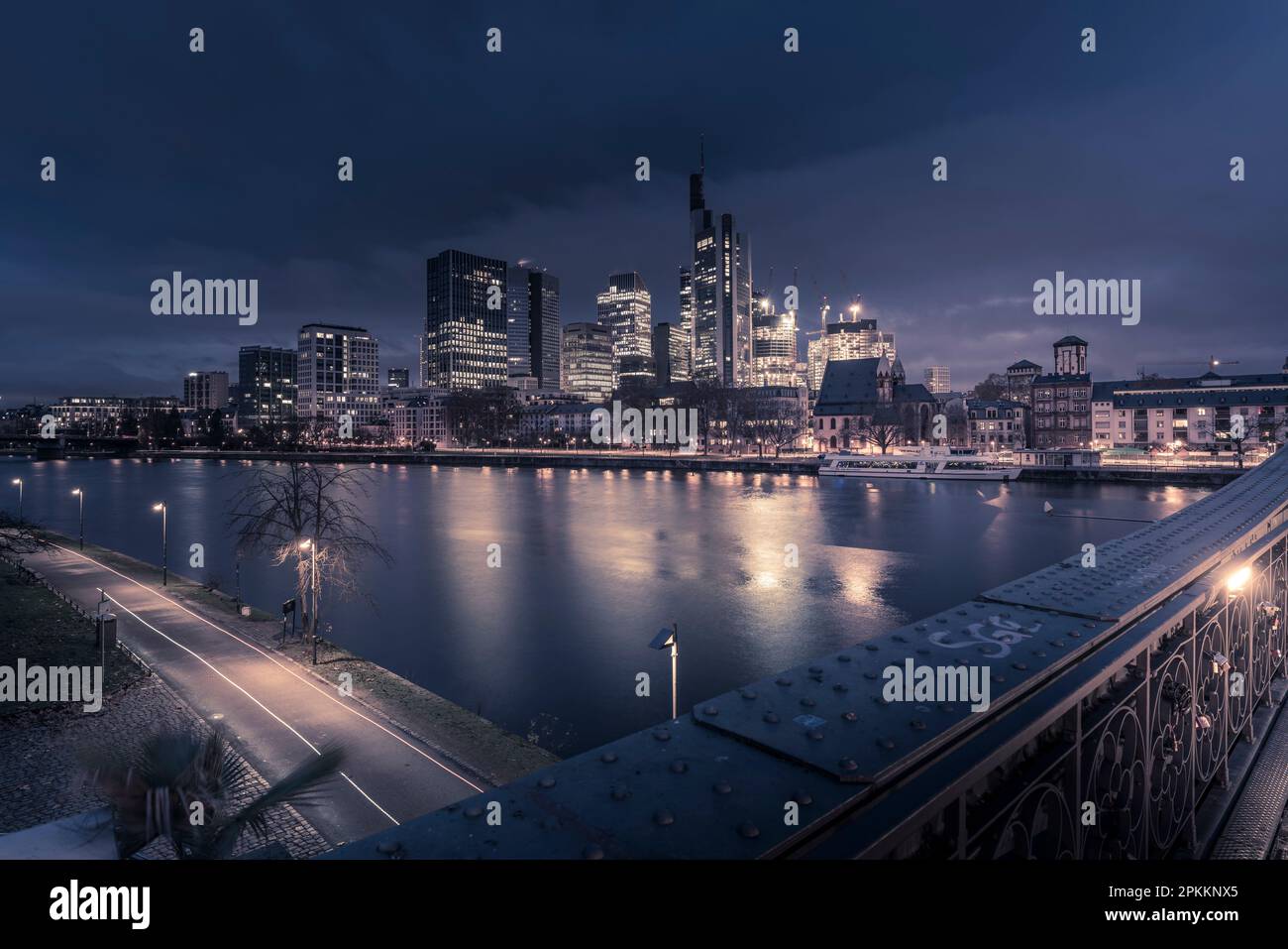 View from Eiserner Steg Bridge across Main River to the skyline of Frankfurt am Main at dawn, Frankfurt am Main, Hesse, Germany, Europe Stock Photo