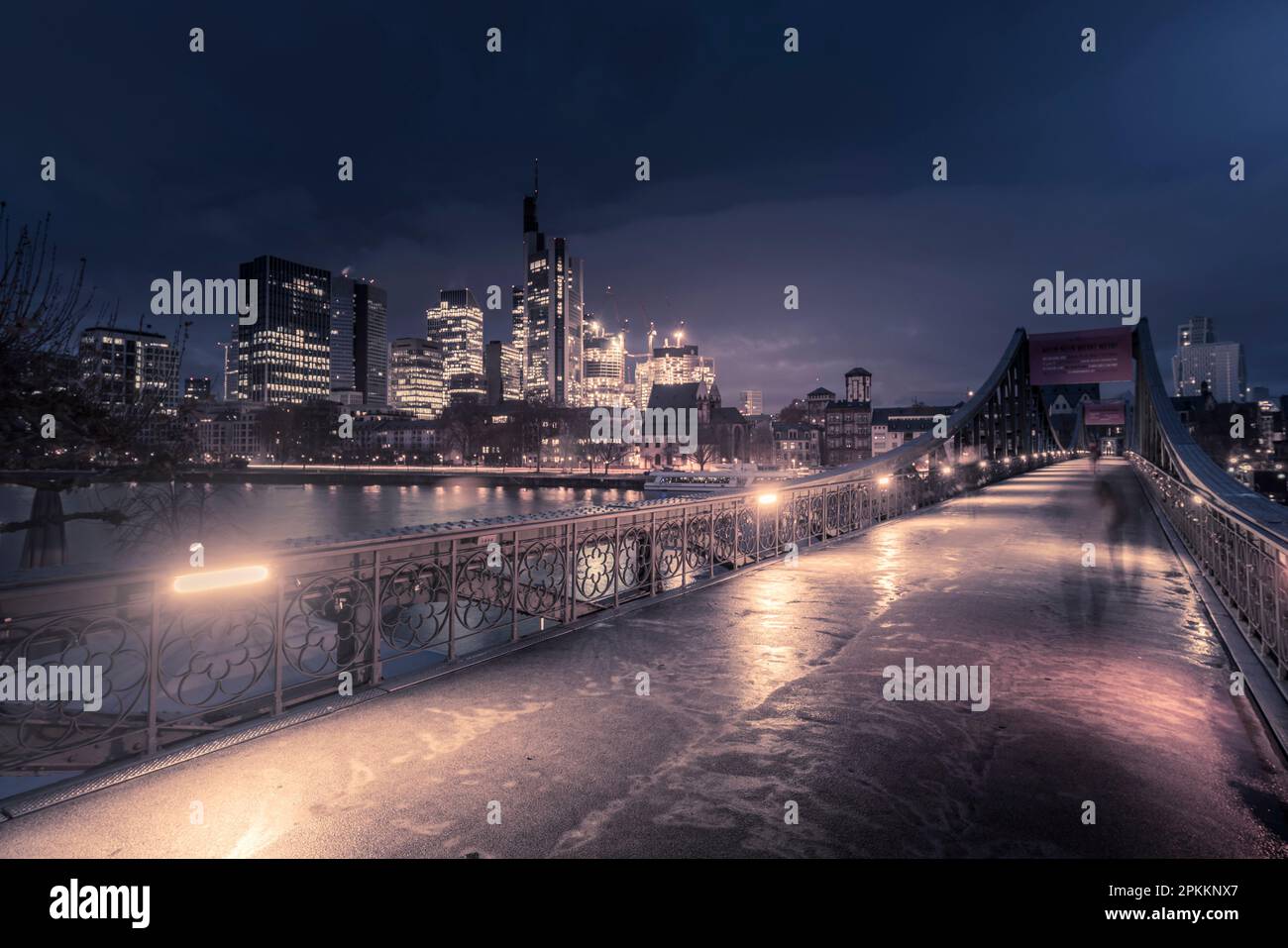 View of Eiserner Steg Bridge and Main River to the skyline at dawn, Frankfurt am Main, Hesse, Germany, Europe Stock Photo