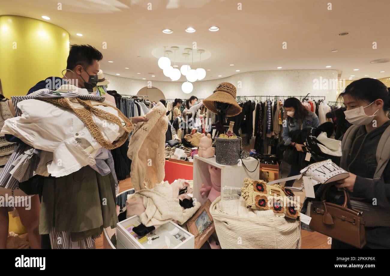 Left) Jeff Wu, fan of Hong Kong singer Kelly Chan Wai-lam, shops in a  charity sale of Chens clothes, shoes and handbags at a shopping mall in Tsim  Sha Tsui. 05APR23 SCMP /