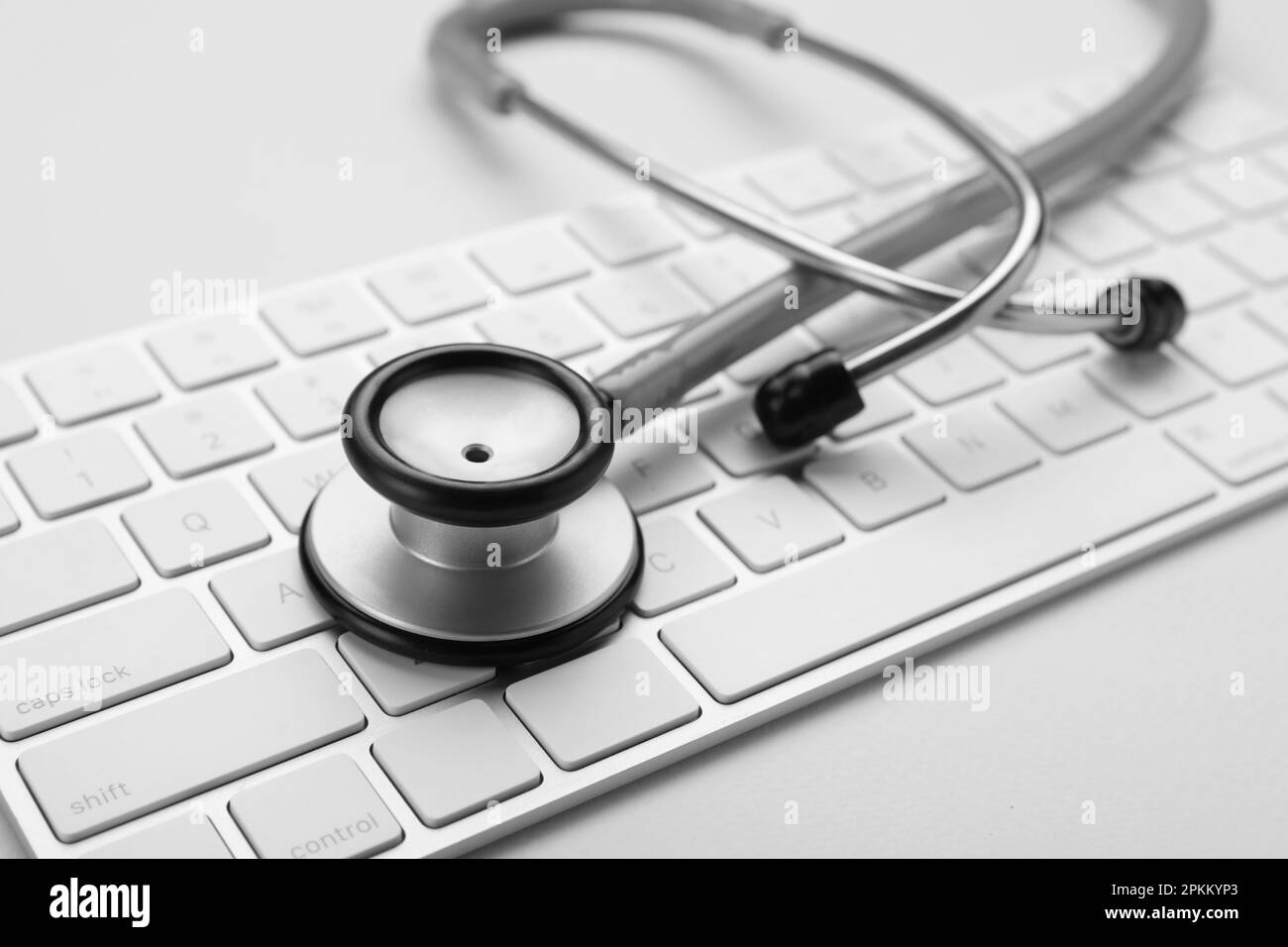 Keyboard and stethoscope on beige background, closeup Stock Photo - Alamy
