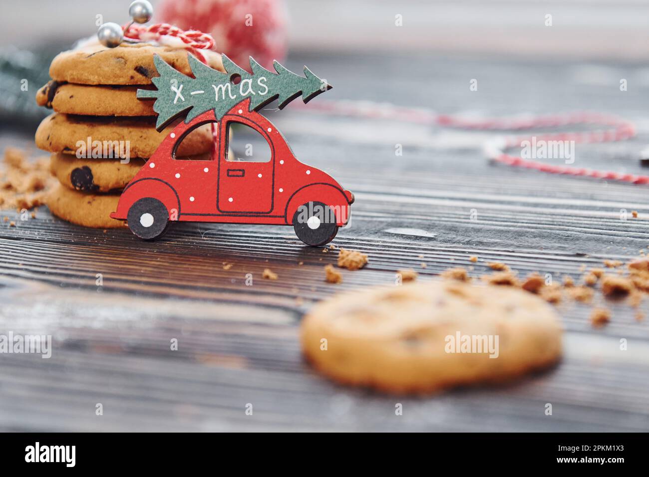 Red toy car. Christmas background with holiday decoration. Stock Photo