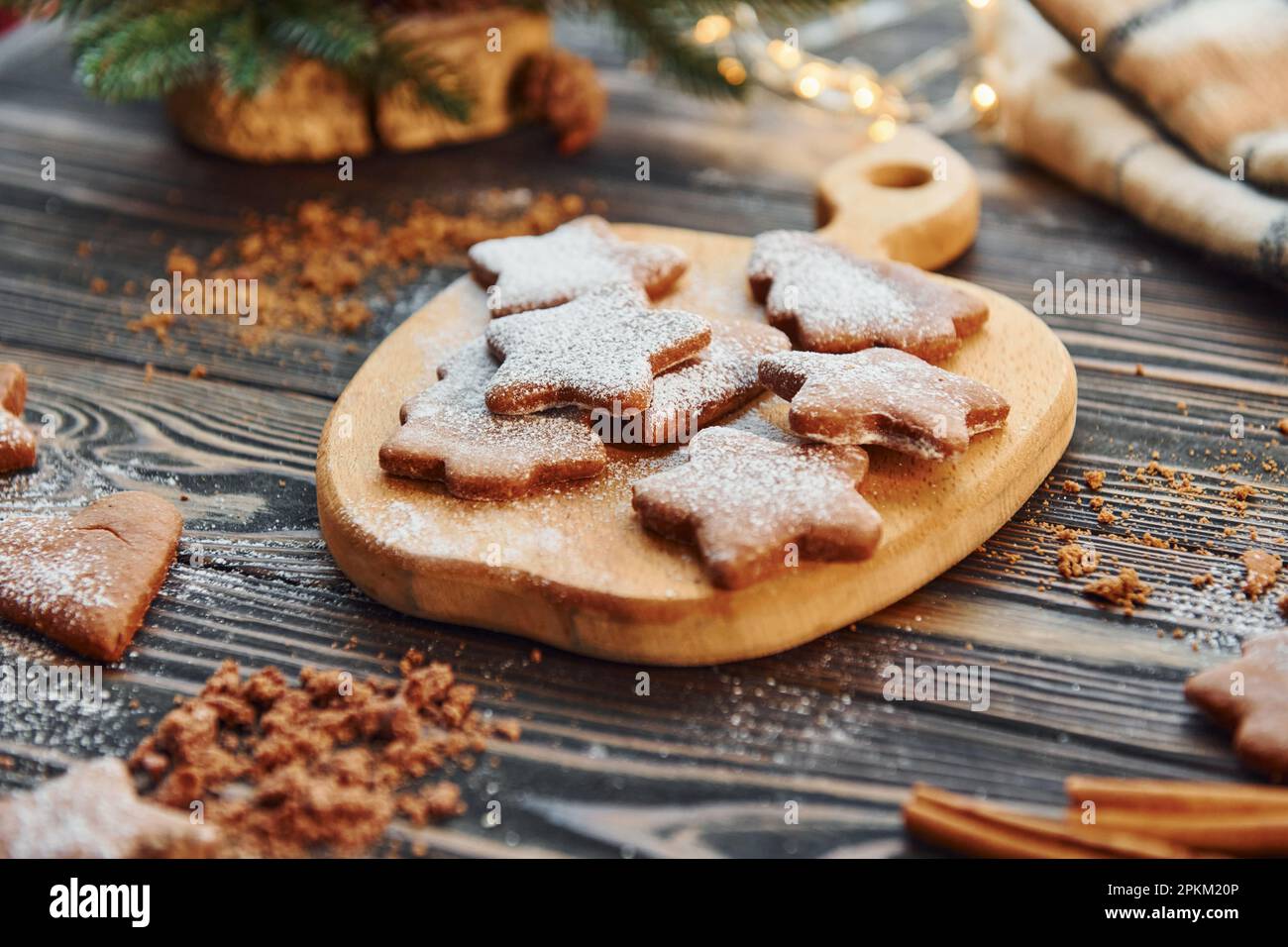 Cookies laying down on the table. Christmas background with holiday decoration. Stock Photo