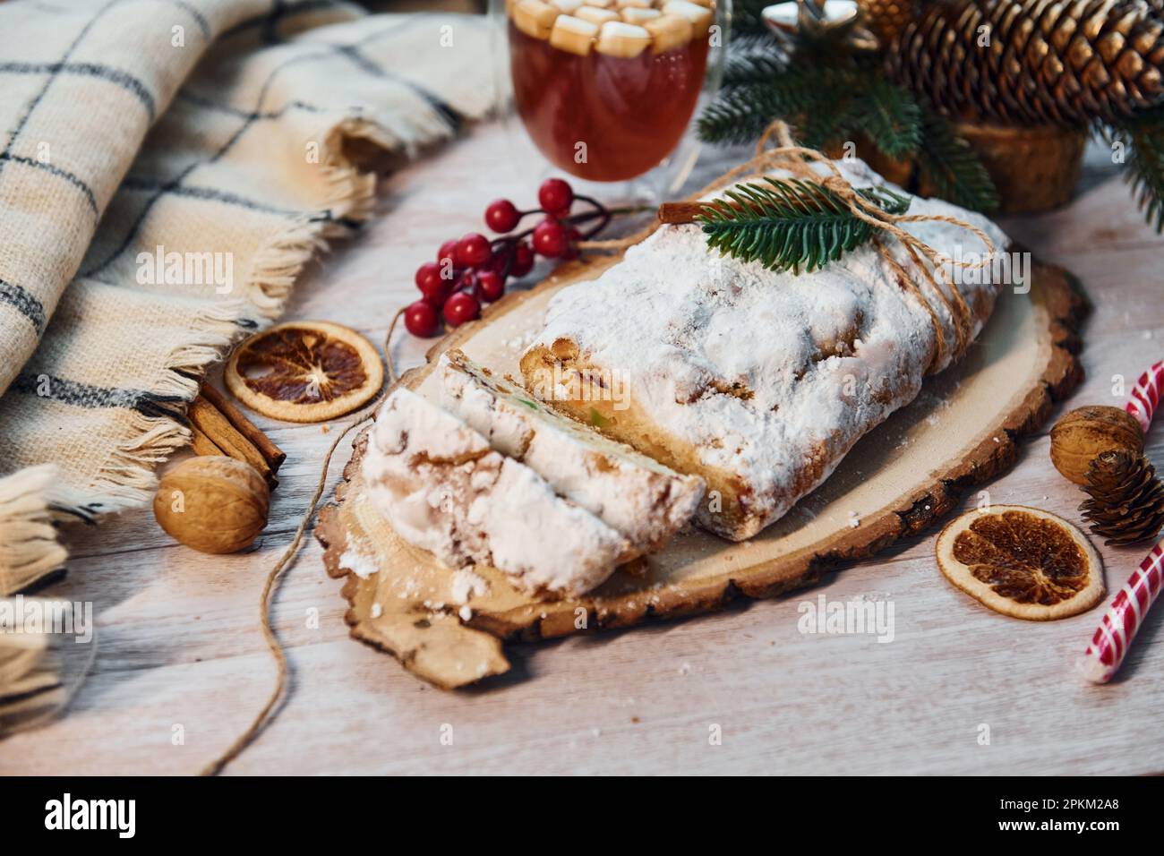 Stollen with holiday decorations. Christmas background. Stock Photo