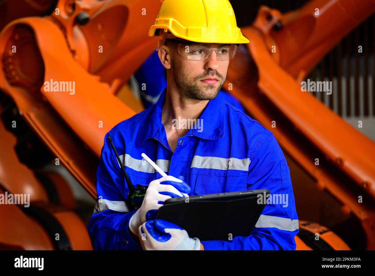 Expertise technicians workers working at industrial plant Stock Photo