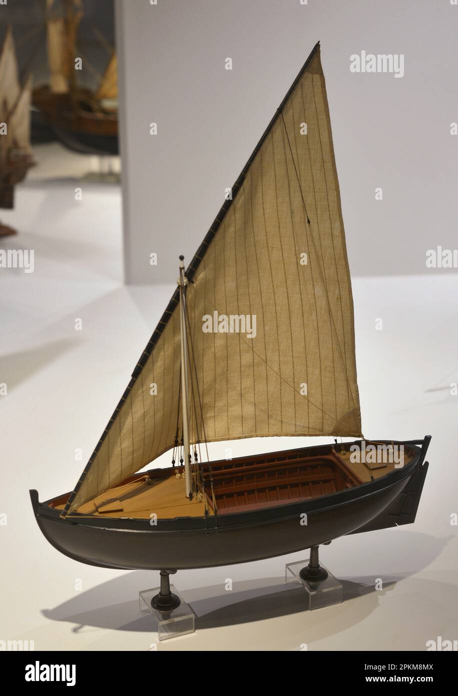 Fishing craft. Small fishing boat. It was used in the first voyages of exploration. In ancient chronicles it is referred to as a "fishing caravel". Model. Maritime Museum. Lisbon, Portugal. Stock Photo