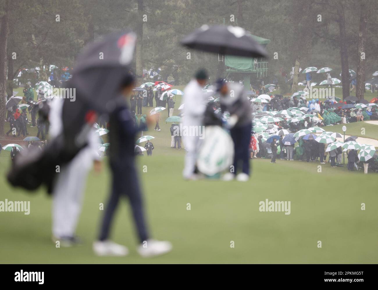 Augusta, United States. 08th Apr, 2023. Patrons walk carrying umbrellas