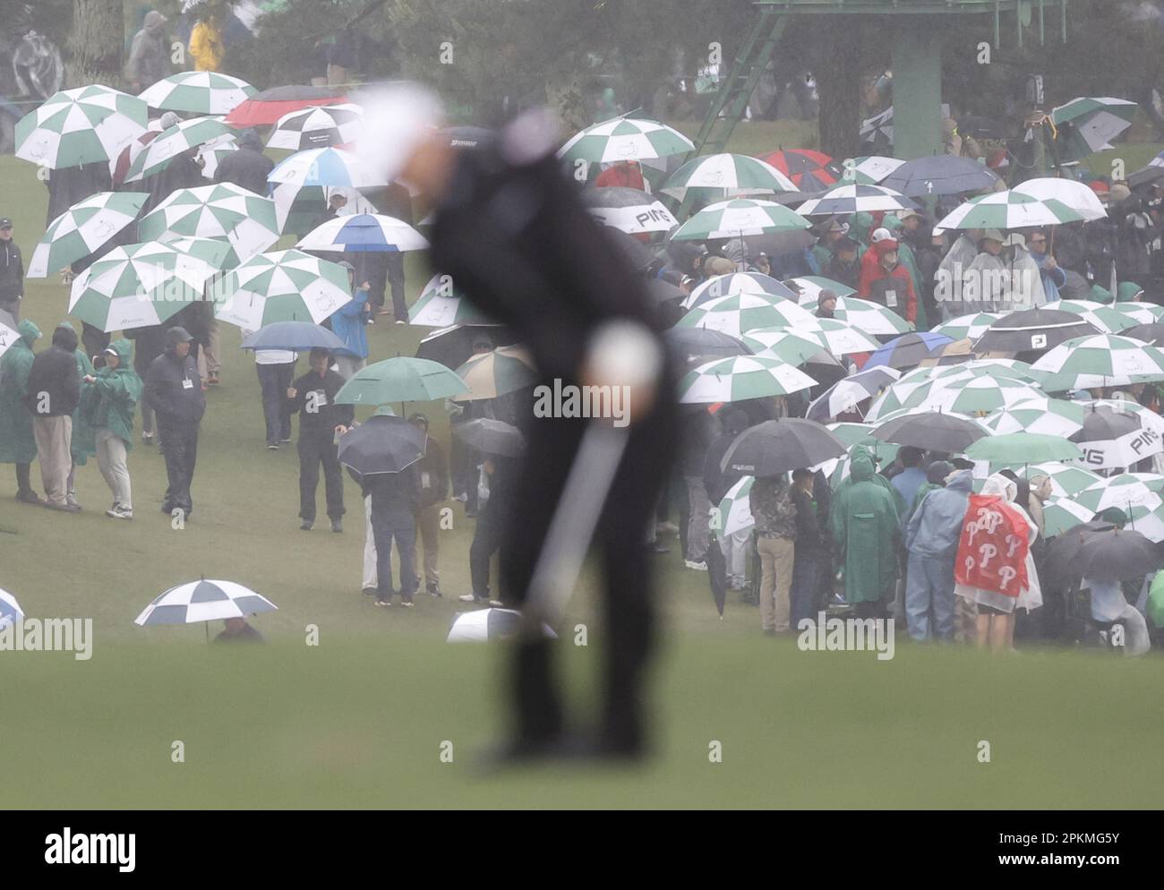 Augusta, United States. 08th Apr, 2023. Patrons walk carrying umbrellas