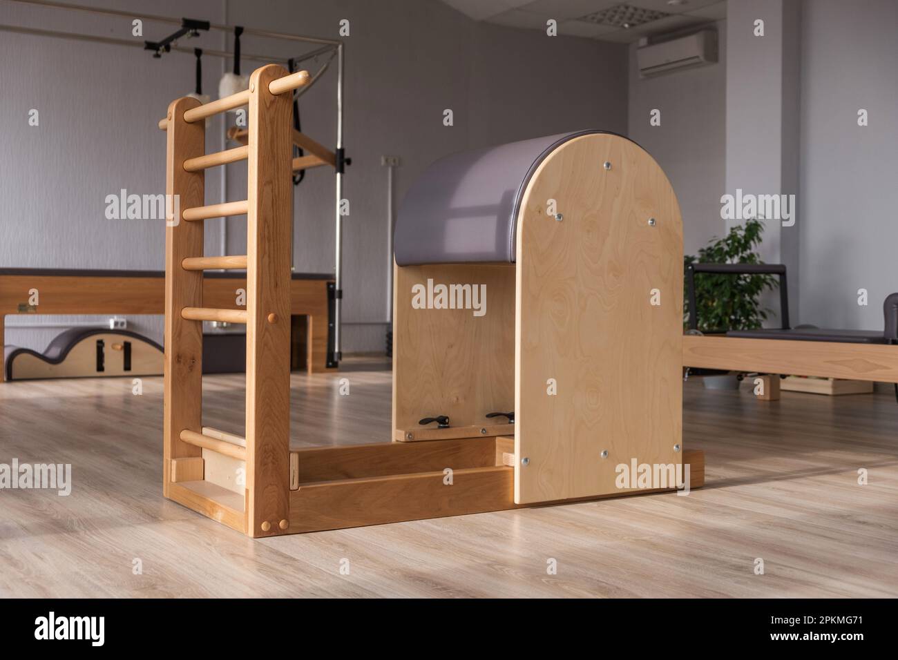 https://c8.alamy.com/comp/2PKMG71/pilates-equipment-balanced-body-ladder-barrel-pilates-studio-machine-for-fitness-workouts-in-gym-fit-healthy-and-strong-authentical-body-fitness-2PKMG71.jpg