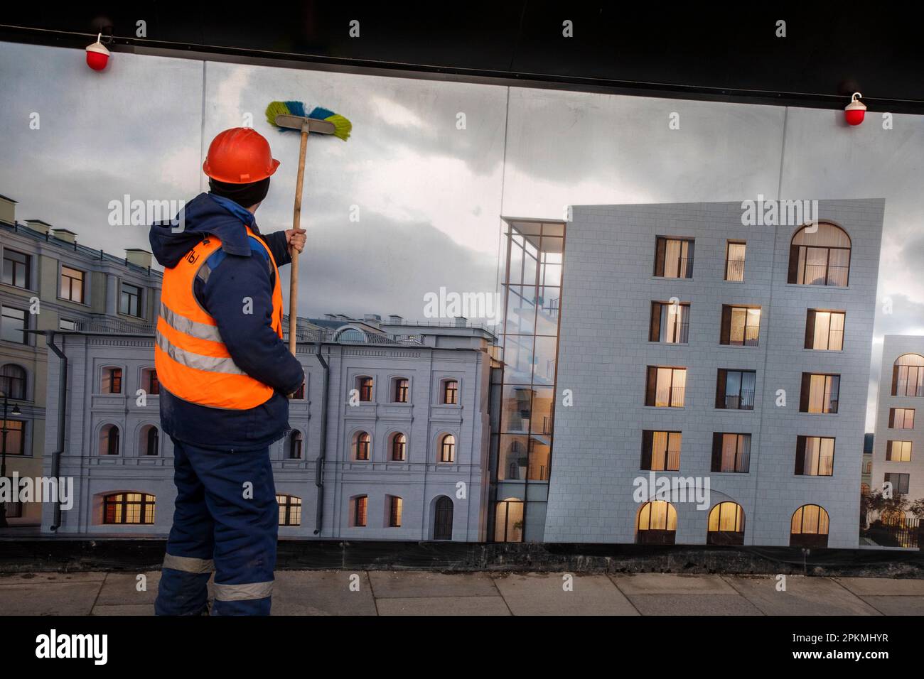 Moscow, Russia. 8th of April, 2023. Employees of municipal services of the city wash a building's facade after the winter season on Bogoyavlensky Lane in the center of Moscow, Russia Stock Photo