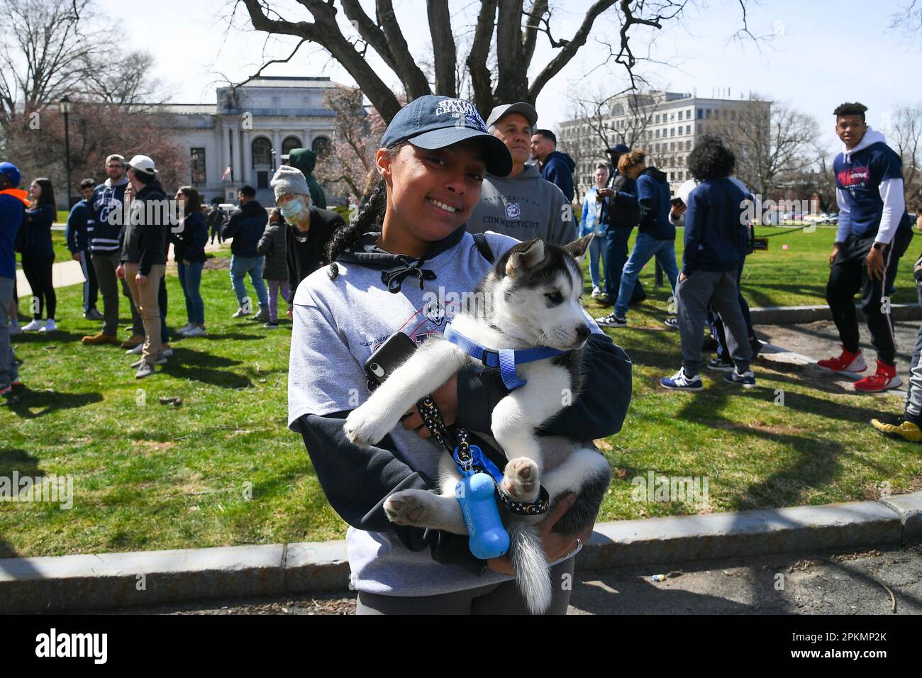 HARTFORD, CT APRIL 08 A UConn fan poses for a photo with their husky
