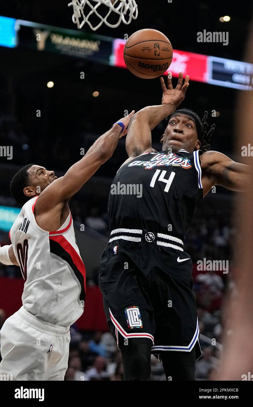 Portland Trail Blazers guard Shaq Harrison, left, knocks the ball from