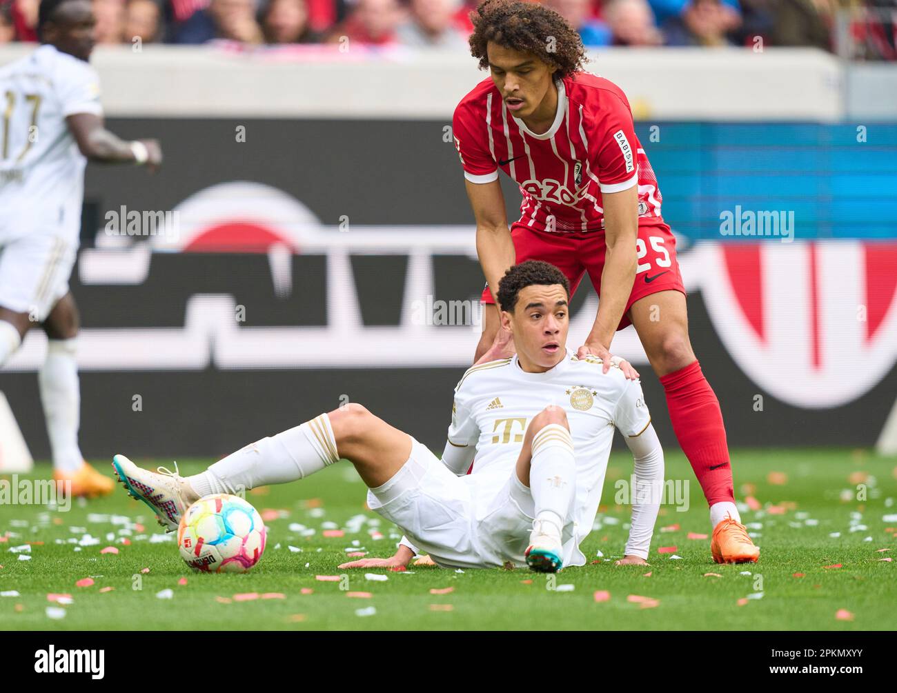 Kiliann Sildillia, FRG 25  compete for the ball, tackling, duel, header, zweikampf, action, fight against Jamal MUSIALA, FCB 42  in the match SC FREIBURG - FC BAYERN MUENCHEN 0-1 1.German Football League on Apr 8, 2023 in Freiburg, Germany. Season 2022/2023, matchday 27, 1.Bundesliga, FCB, BVB, München, 27.Spieltag. © Peter Schatz / Alamy Live News    - DFL REGULATIONS PROHIBIT ANY USE OF PHOTOGRAPHS as IMAGE SEQUENCES and/or QUASI-VIDEO - Stock Photo