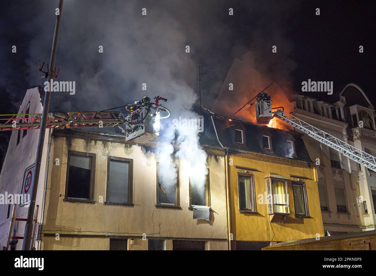 Koblenz, Germany. 08th Apr, 2023. Firefighters fight the fire of two residential buildings in the Koblenz district of Pfaffendorf. The rescue service including emergency doctor treated two people with suspected smoke inhalation, said a statement from the fire department. Credit: Thomas Frey/dpa/Alamy Live News Stock Photo