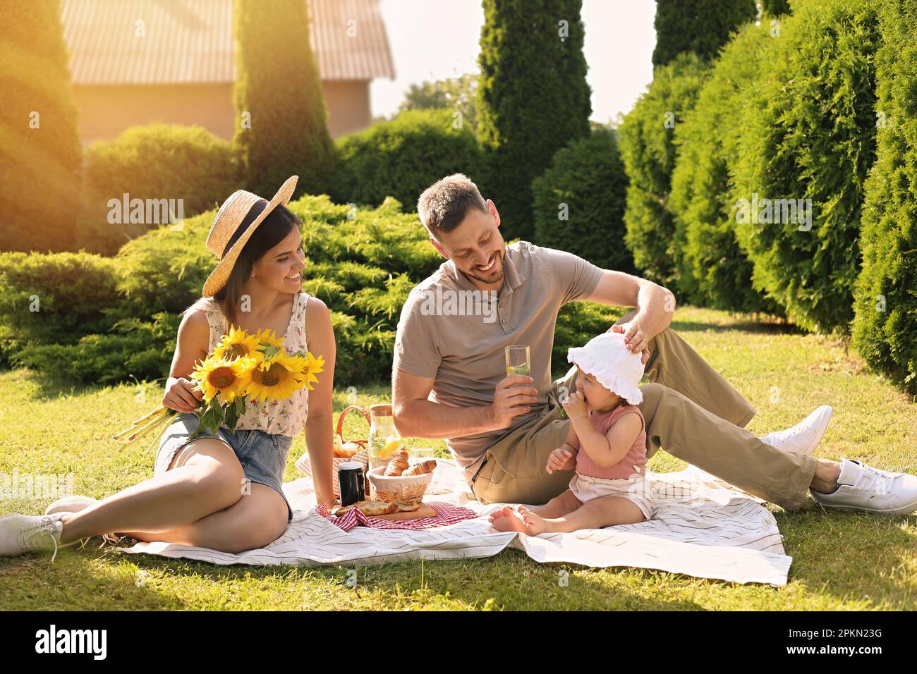Happy family having picnic in garden on sunny day Stock Photo - Alamy