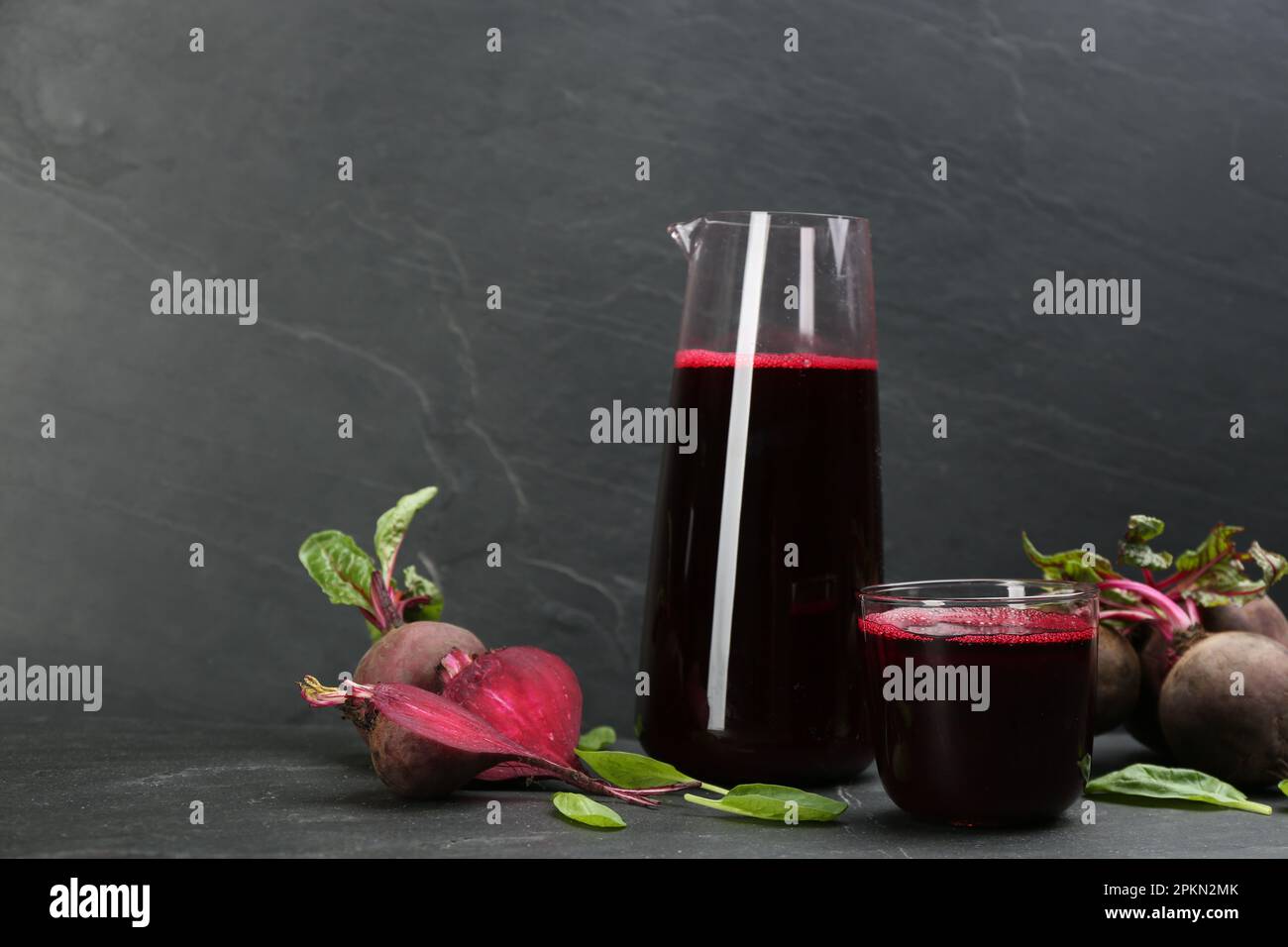 Freshly made beet juice on black table Stock Photo
