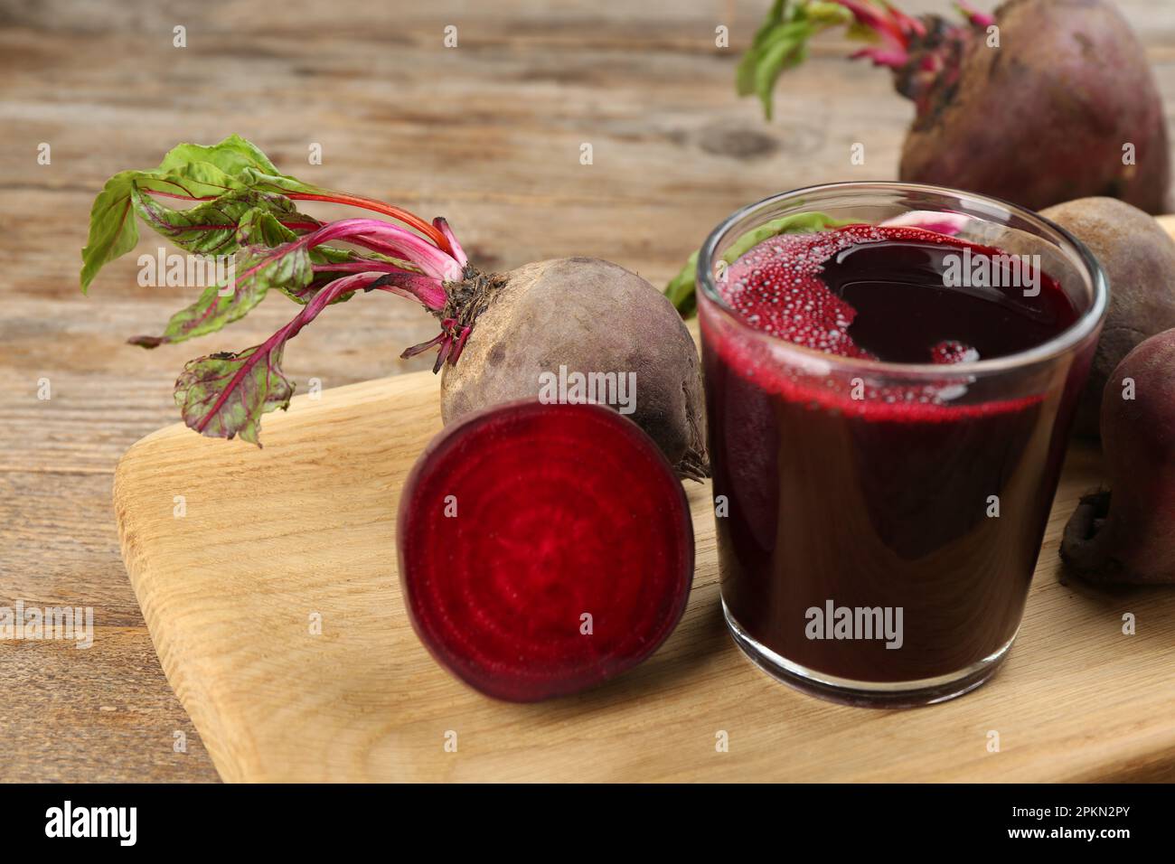 Freshly made beet juice on wooden table Stock Photo