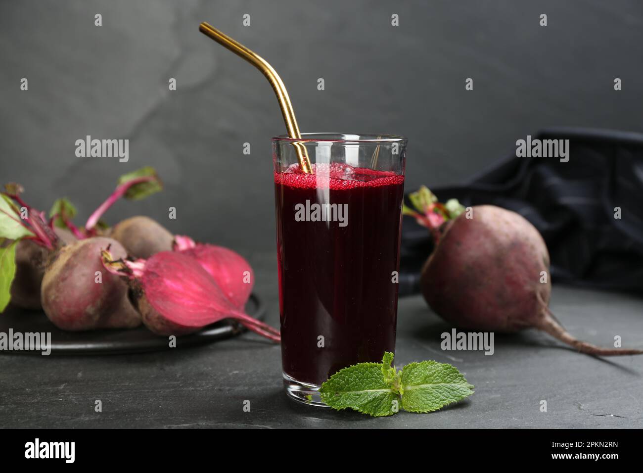 Freshly made beet juice on black table Stock Photo