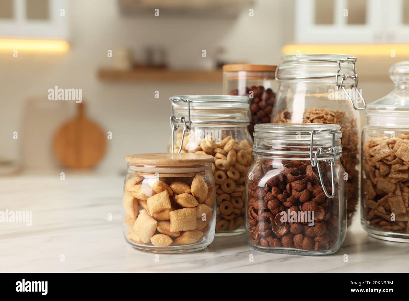 A kitchen counter topped with jars filled with food photo – Zero
