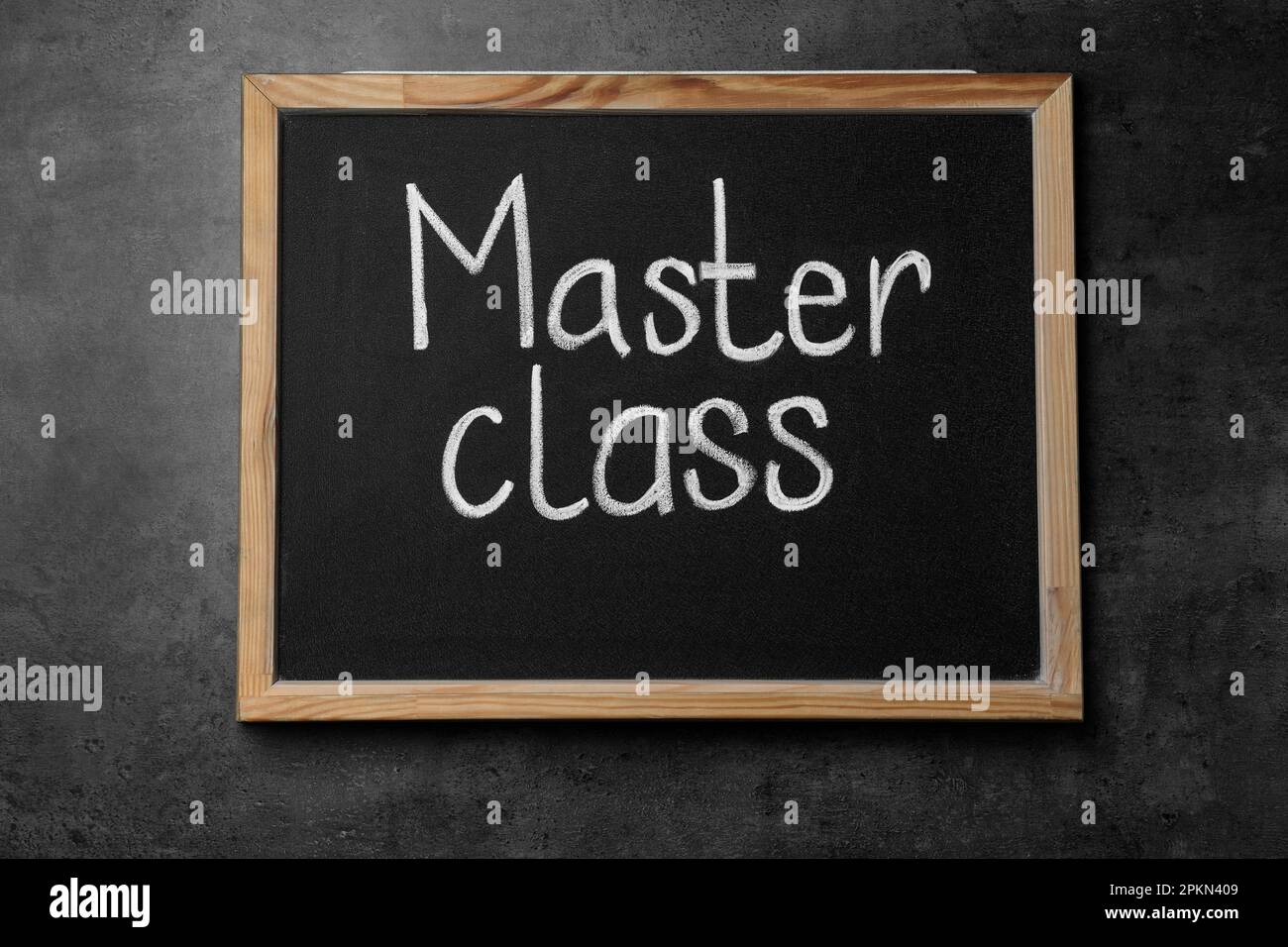 Blackboard with words Master Class on grey table, top view Stock Photo