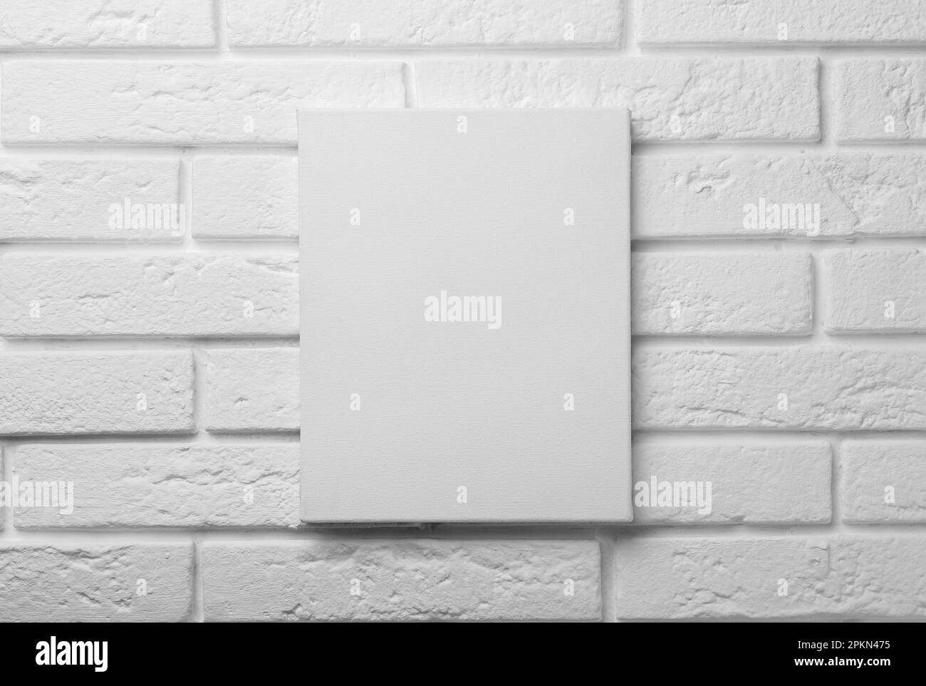 Blank canvas on white brick wall. Space for design Stock Photo Alamy