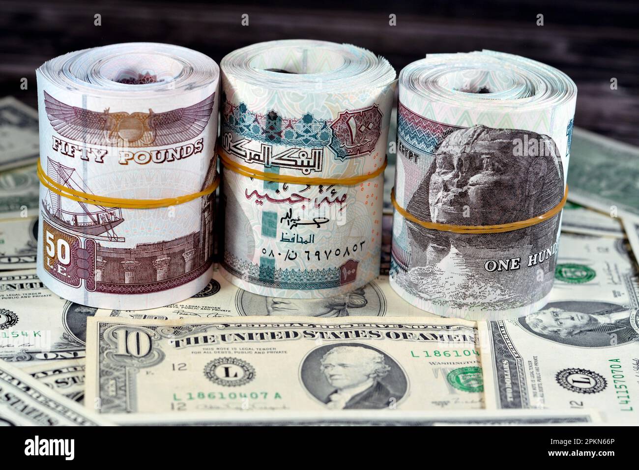 Rolls of Egypt money banknote bills of 100 and 50 EGP LE one hundred