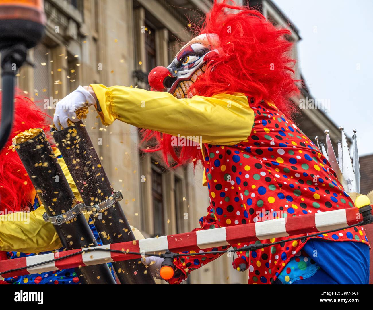 clowns on parade float throwing confetti on the crowd at the Basel