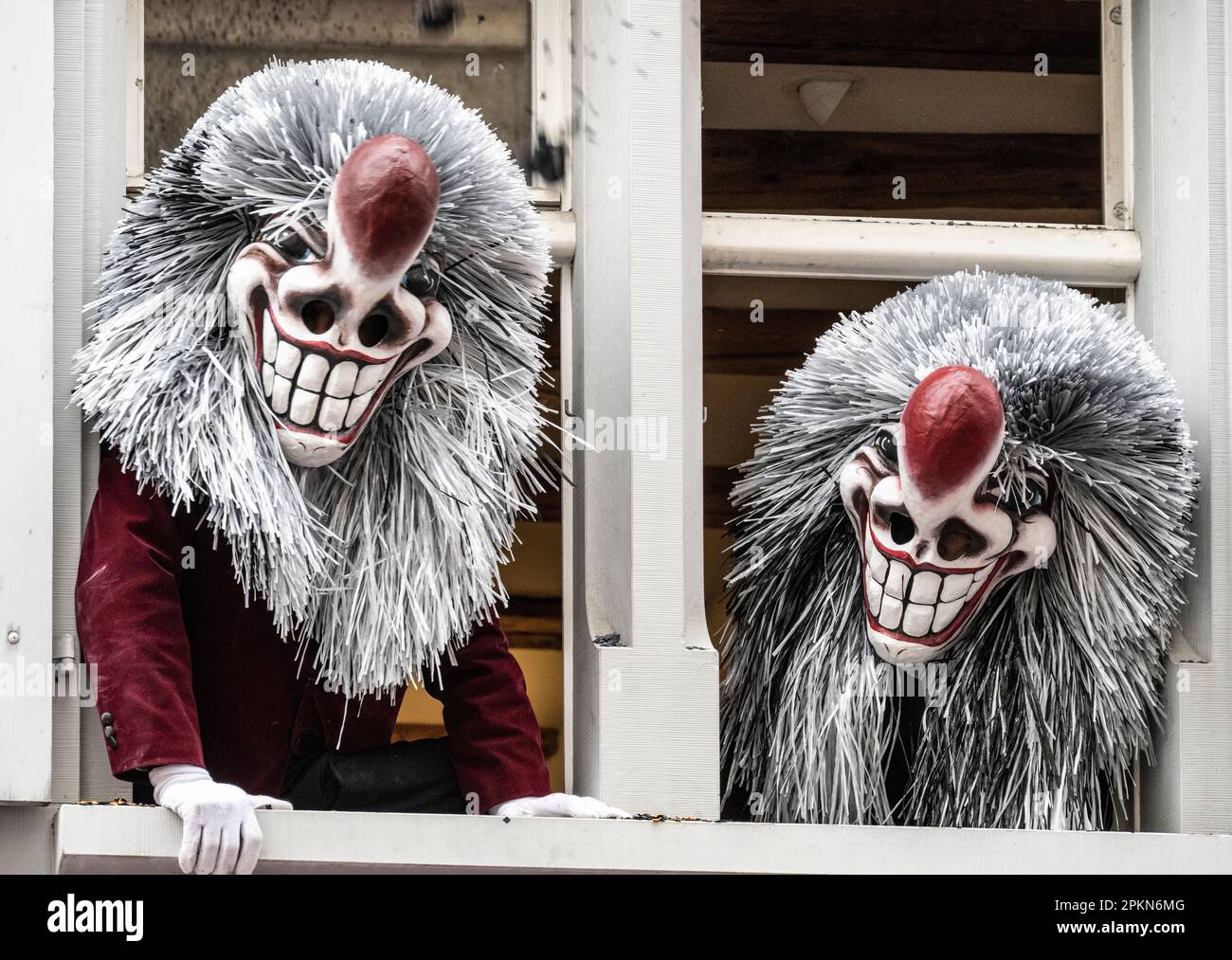 Basbl Masks Two Waggis mask costumes at a window during the Basel Fasnacht carnival ...