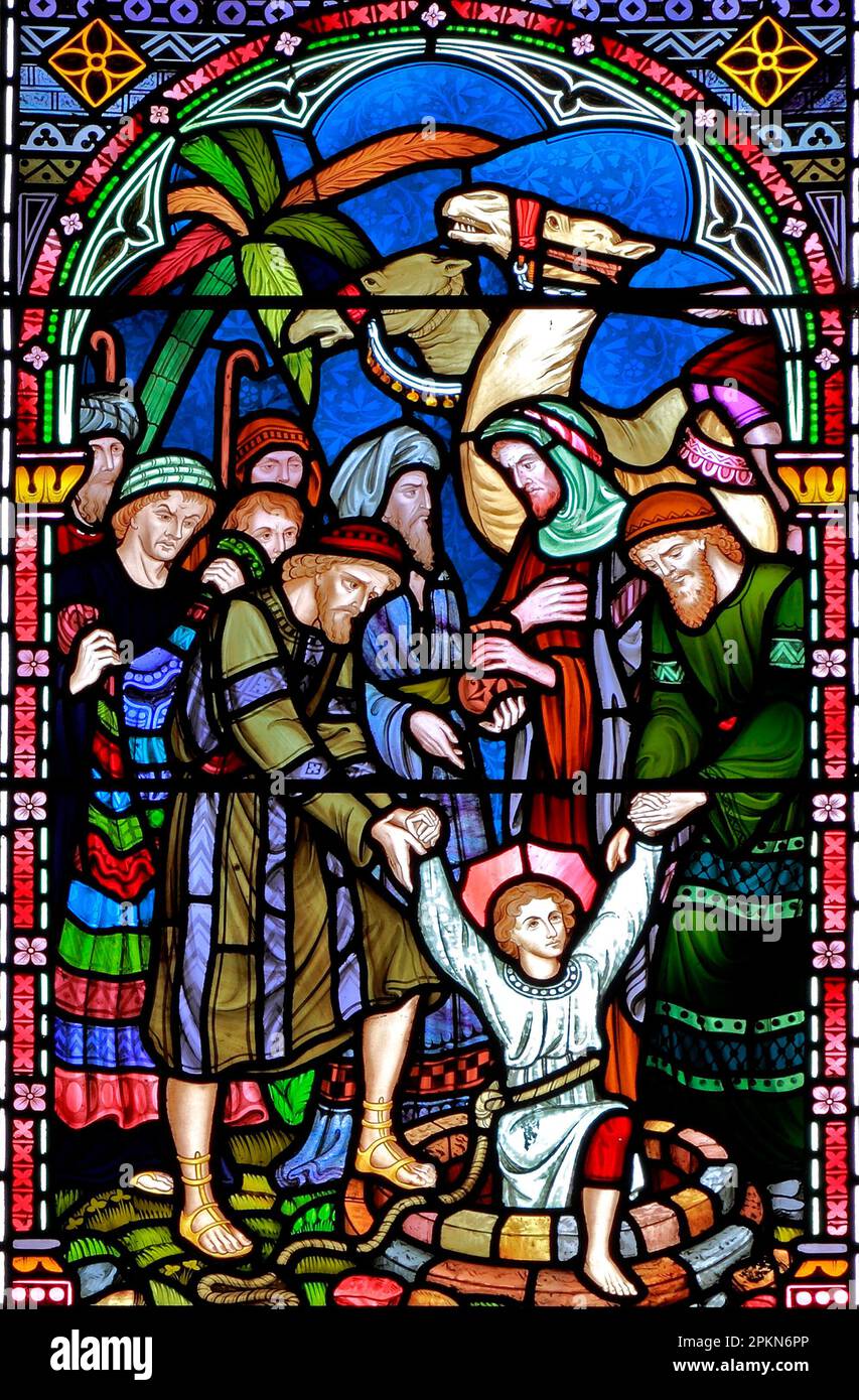 Joseph taken from the Well, to be sold to The Ishmaelites, Old Hunstanton, detail of stained glass window by Frederick Preedy, 1867 Stock Photo