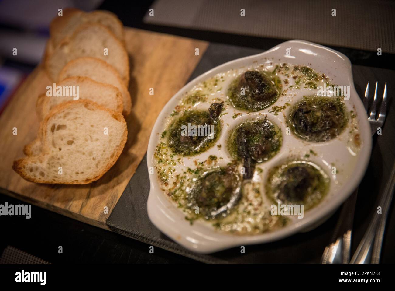 Baked Escargot with Bread and utensils Stock Photo Alamy