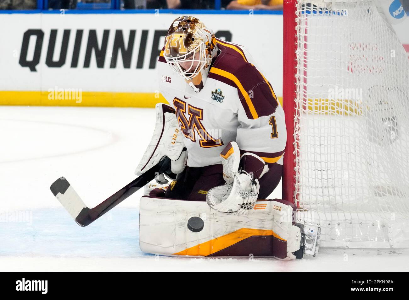Minnesota goaltender Justen Close (1) makes a save on a shot by