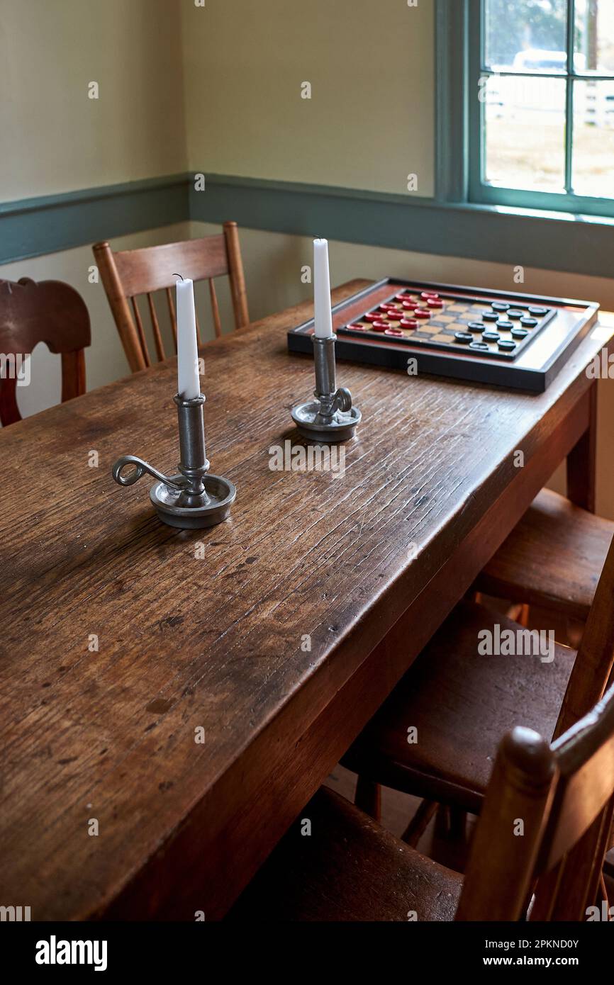 A tavern table in window light at the Lewes (Delaware) Historical Society's Sussex Tavern building. Stock Photo