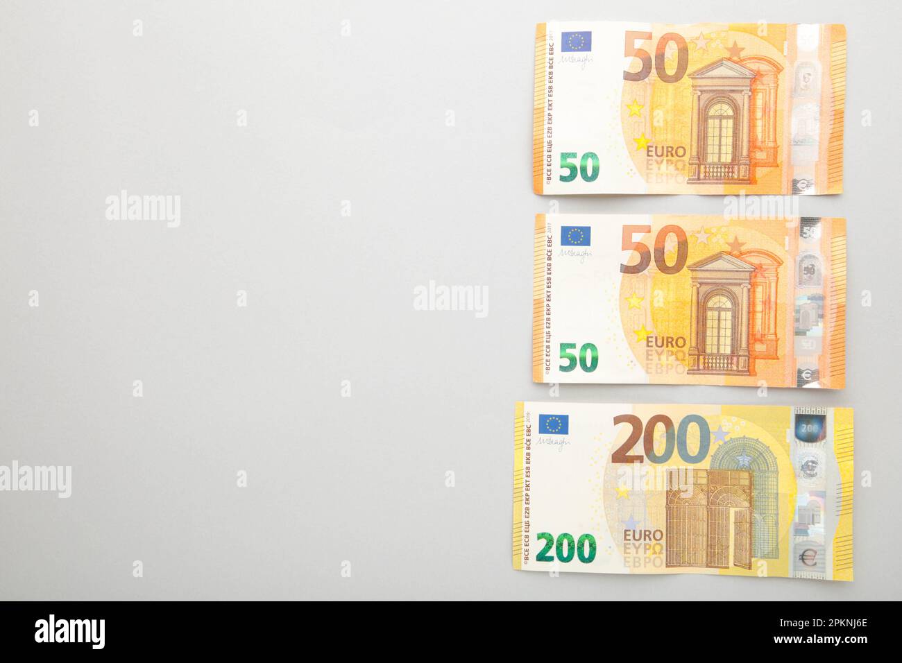 Banknotes of euro on grey background. Place for text. Top view Stock ...