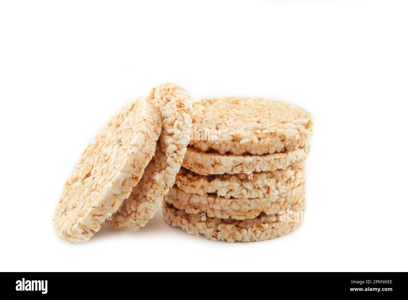 A stack of dietary round, airy, crisp buckwheat crispbread on white