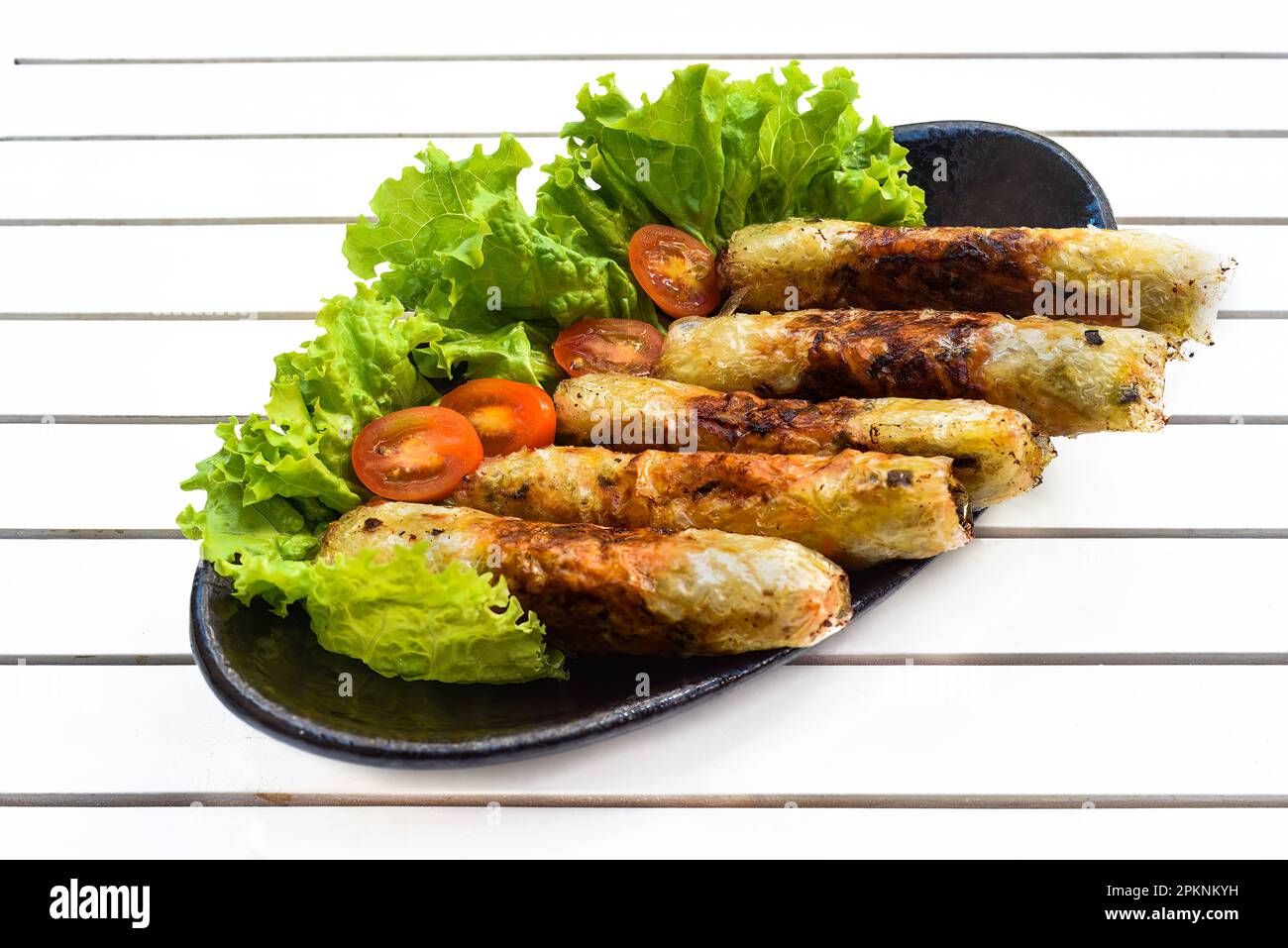 Traditional fried vietnamese spring rolls with pork, rice paper on