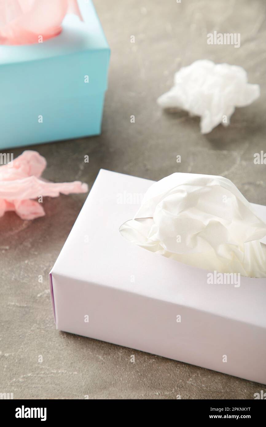 Two tissue box on grey background. Top view Stock Photo