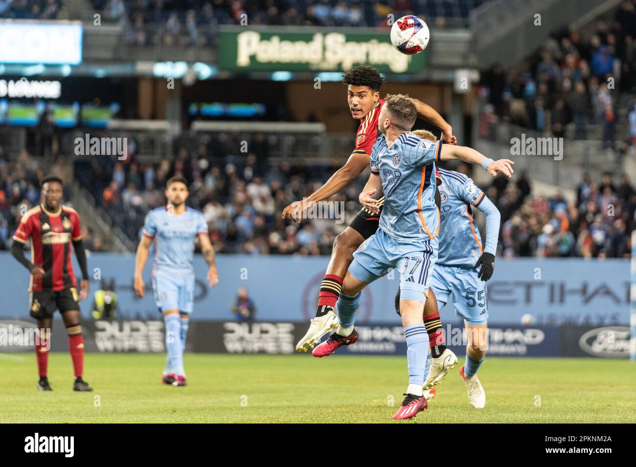 Matias Pellegrini (17) of NYCFC and Caleb Wiley (26) of Atlanta United fight for the air ball during regular MLS season match at Yankee Stadium on April 8, 2023. Stock Photo