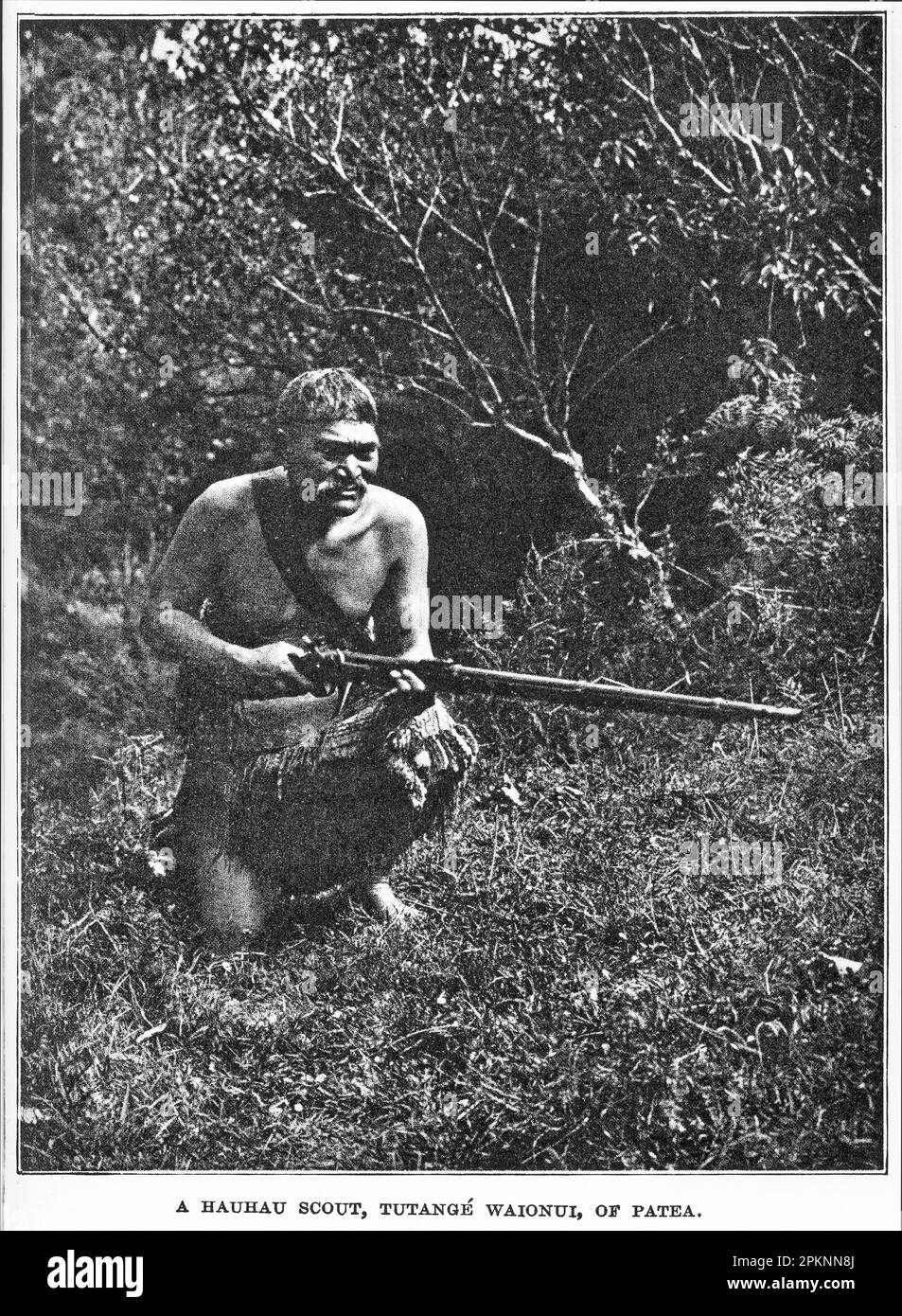 1908 Portrait of Tutange Waionui, a Hauhau warrior, posing in the clothes he wore when on the war-path in 1868 agains the New Zealand colonial government. Stock Photo