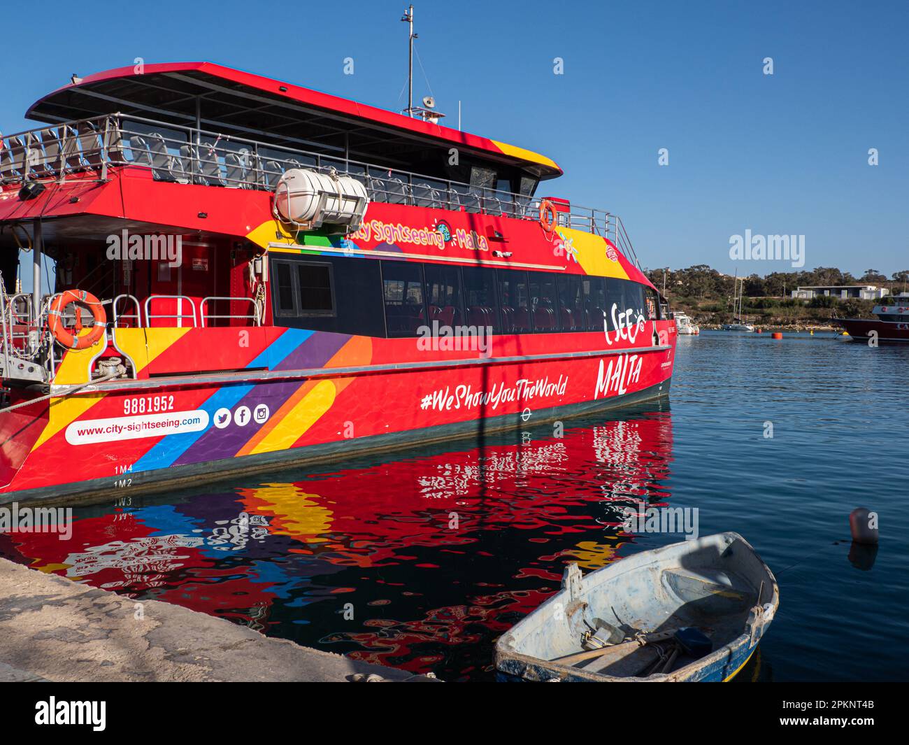 Sliema, Malta - May, 2021: Touristic red ship 'hop on hop off' in the port of Sliema district. Sliema Ferry port. Malta. Europe Stock Photo