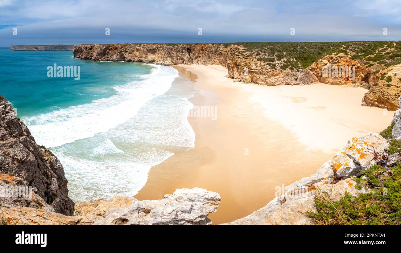 High-angle view of the deserted Praia do Beliche beach in the Algarve region of Portugal with shallow waves and a scenic panoramic view. Stock Photo