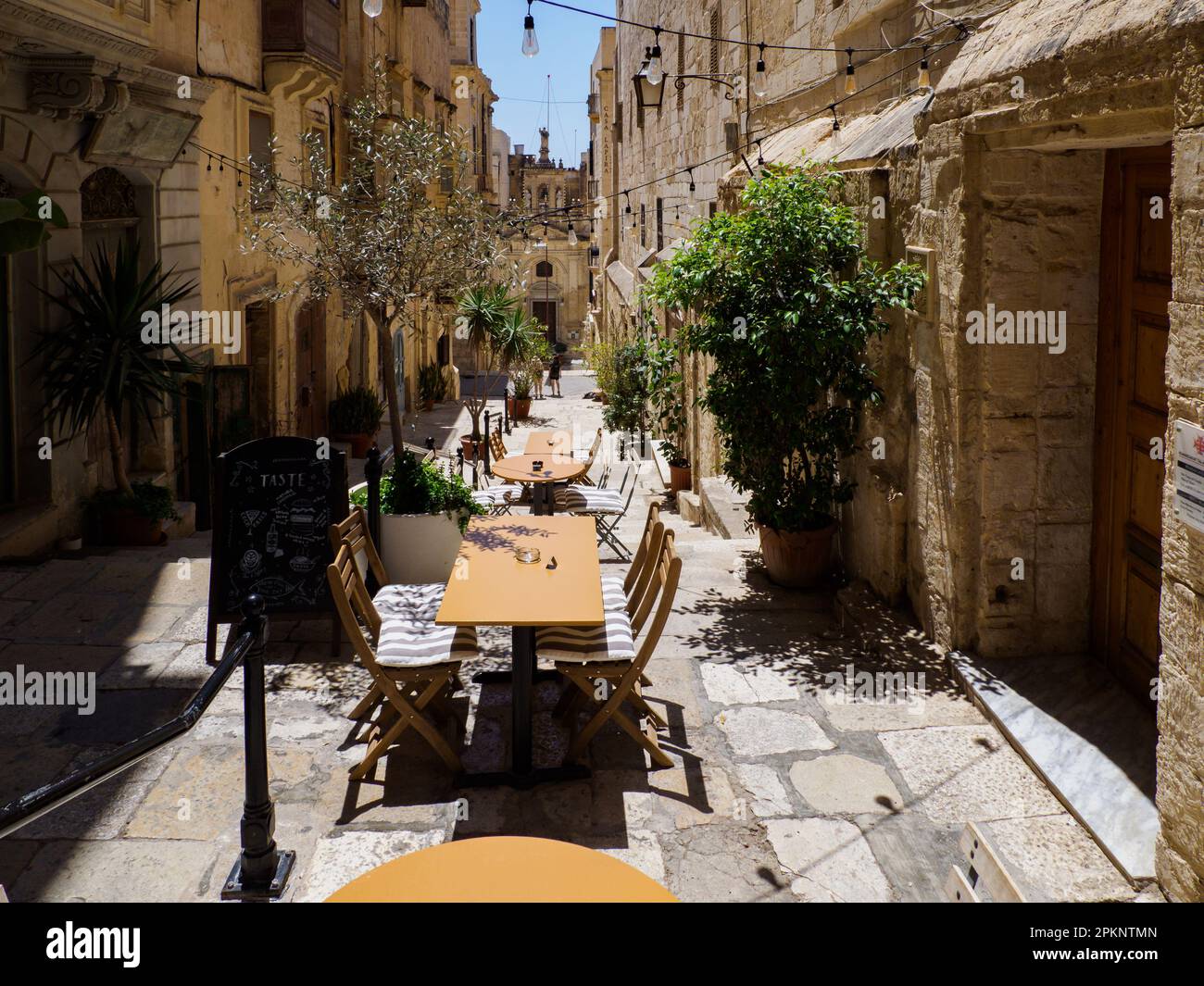 Valletta, Malta May, 2021 Wooden restaurant tables on the steps of a
