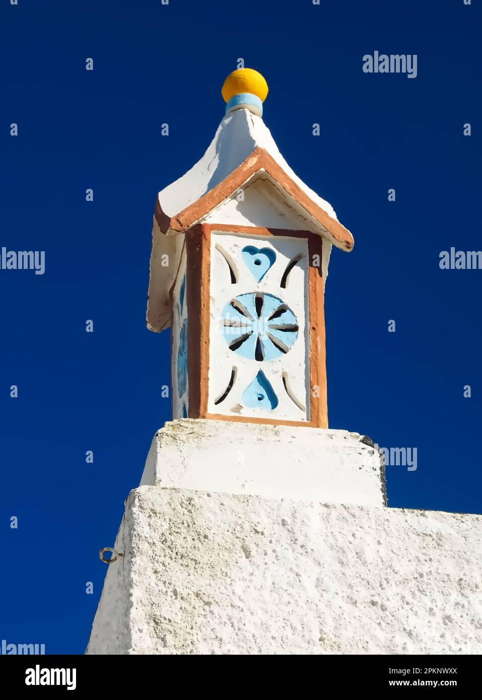 cute portuguese chimney with blue sky Stock Photo