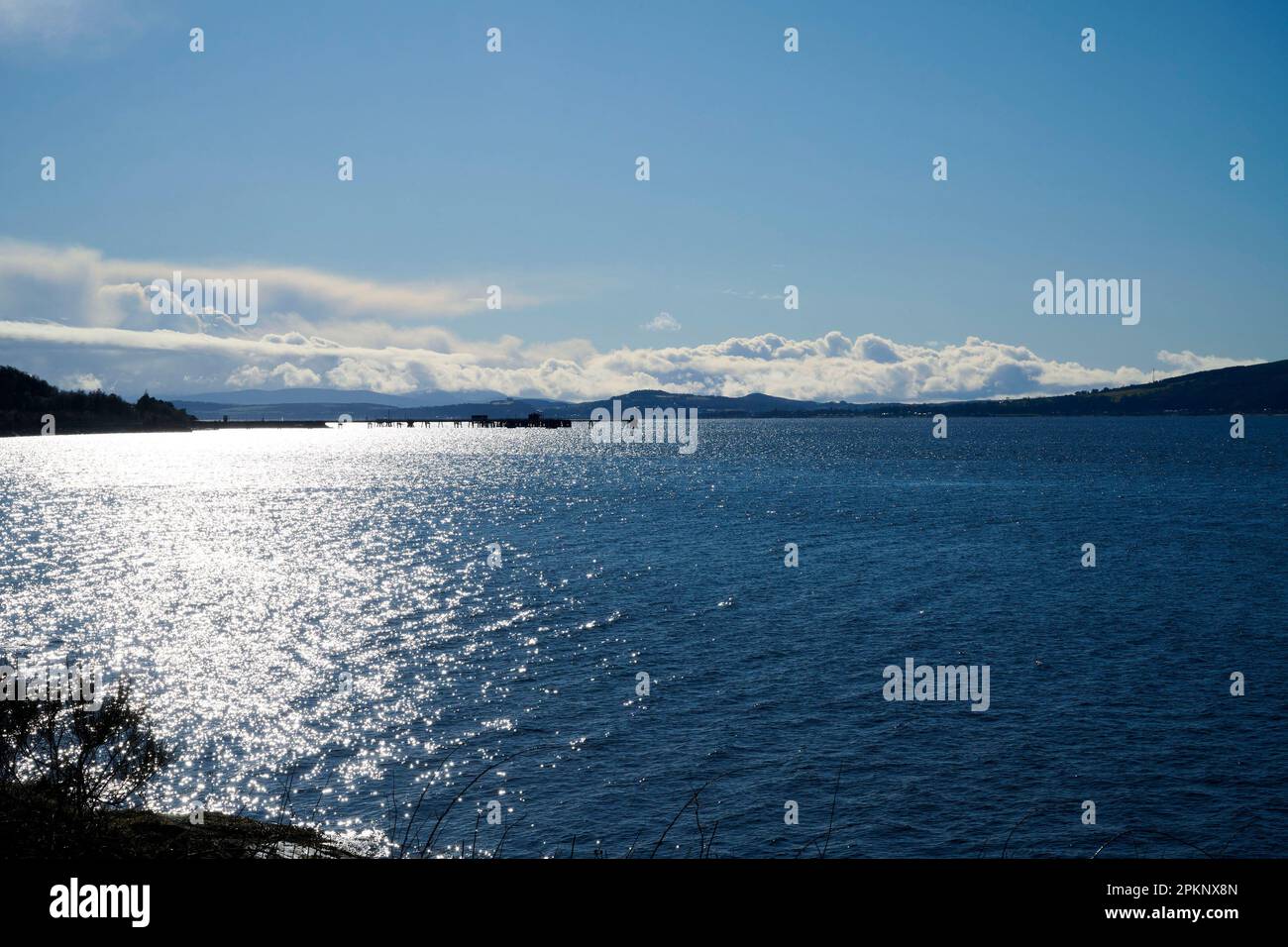 The Clyde Estuary at Inverkip Bay, Western Scotland, UK showing snow cover mountains across the water Stock Photo
