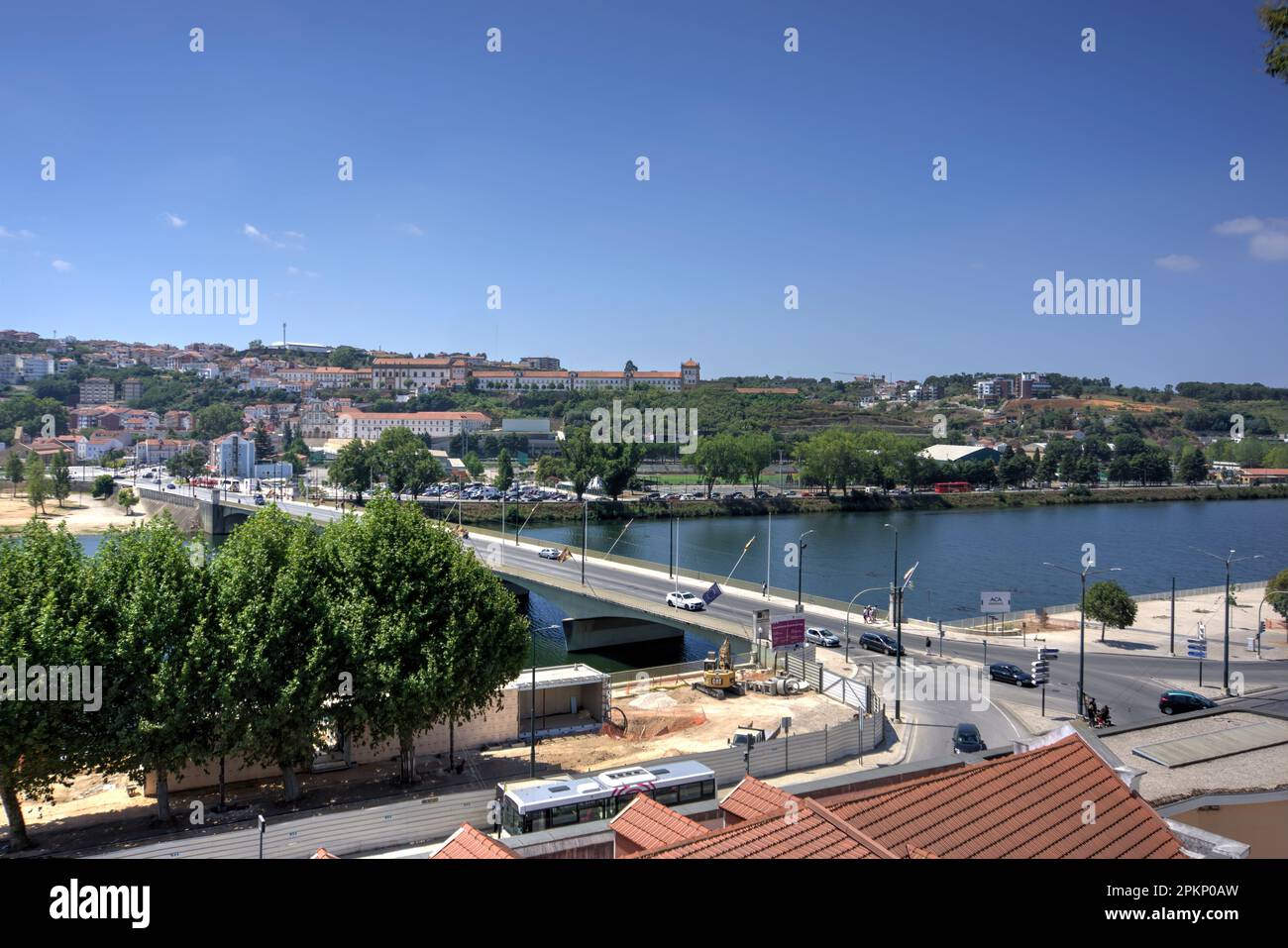Coimbra, Portugal - August 15, 2022: View of Santa Clara Bridge from north-west side of River Mondego with city in background Stock Photo