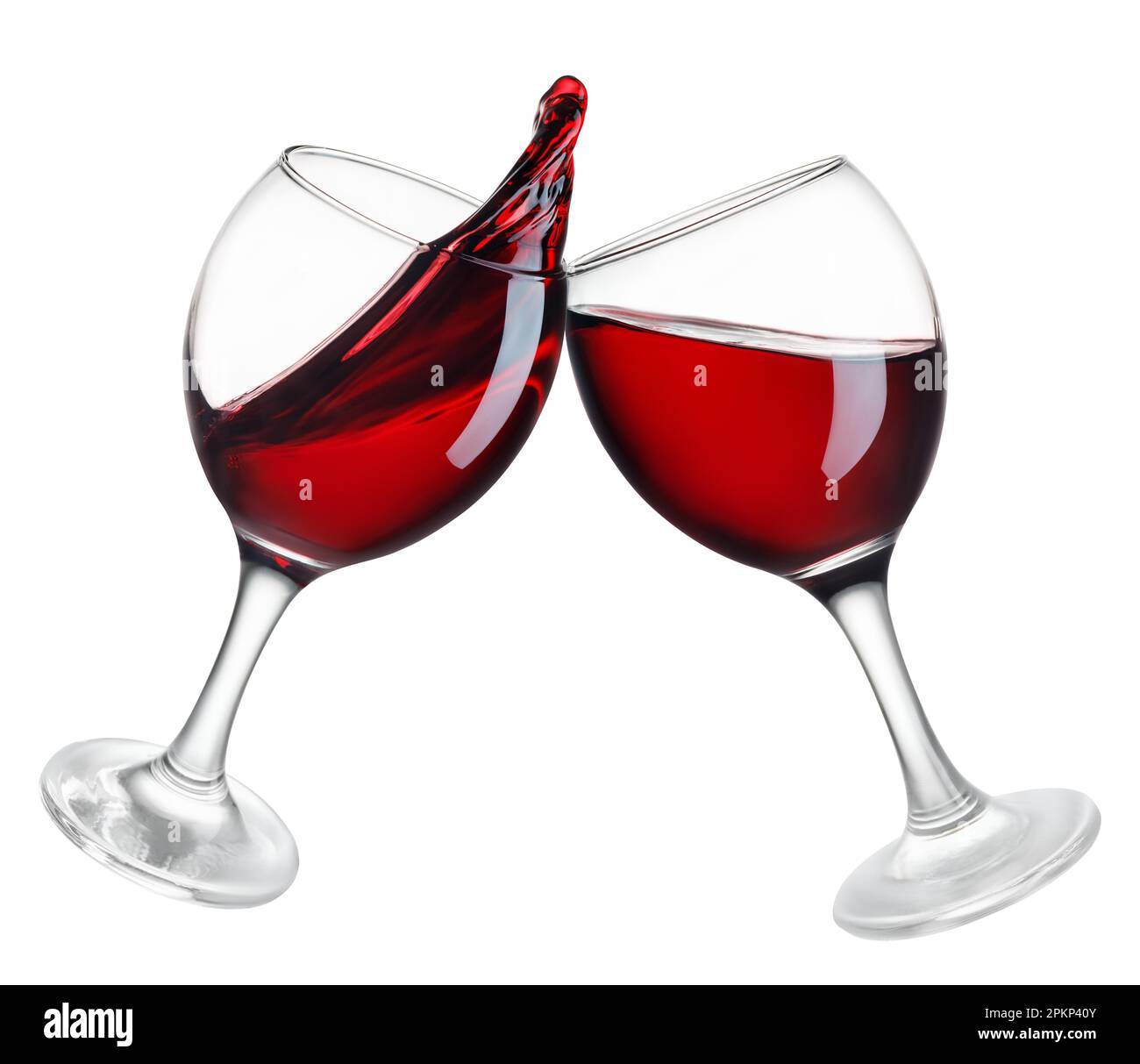 two glasses of red wine in toasting gesture with splash isolated Stock